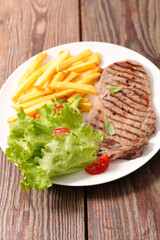 grilled beef steak and french fries