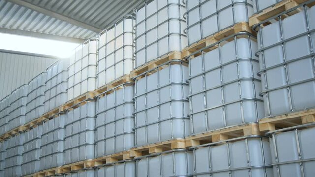 Intermediate Bulk Containers in Metal Frames in Light Rays