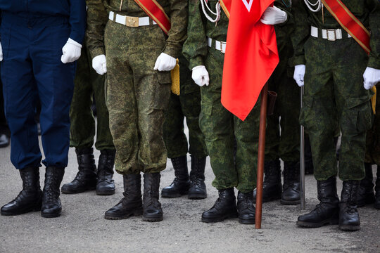 View At The Black Lowquarters And Military Uniform Of Unrecognizable Russian Soldiers Standing In Line, Russia