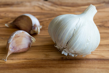 A head of garlic on a wooden background