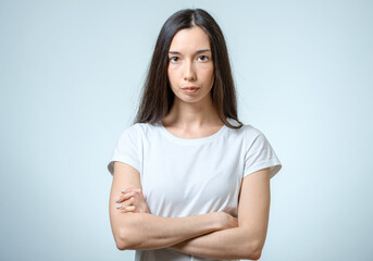 Fototapeta premium Portrait of beautiful young confident woman with serious expression