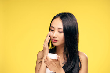 cream for caring for problem skin, Asian woman