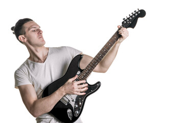 Music and creativity. Handsome young man in a T-shirt playing an electric guitar. Horizontal frame