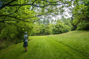 Obraz premium Woman Standing in Forest Landscape 
