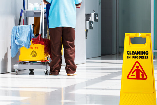 Janitorial and mop bucket on cleaning