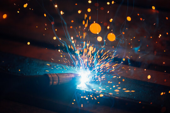 artistic welding sparks light, industrial background