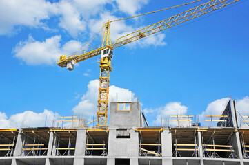 Crane and highrise construction site