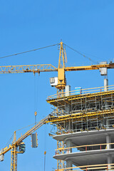 Crane and highrise construction site