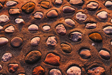 Stones in a sand, natural background.