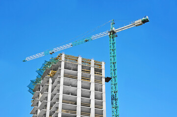 Crane and highrise construction site