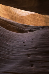 Moqui steps rise inside Peek-A-Boo slot canyon, near Kanab, Utah