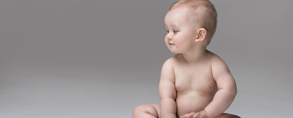 Adorable little baby boy posing.