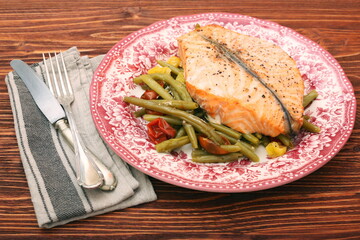 Salmon steak, veggies and herbs