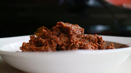 Beef Rendang, traditional Indonesia food. Dried beef curry with coconut milk and spices.