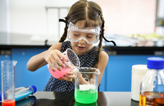 Kindergarten Student Mixing Solution in Science Experiment Laboratory Class