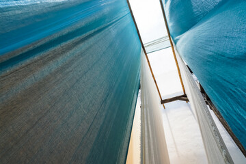 colorful fabric hanging to dry after traditional dye process,shot in Heng Dian Town,Zhejiang province of China.