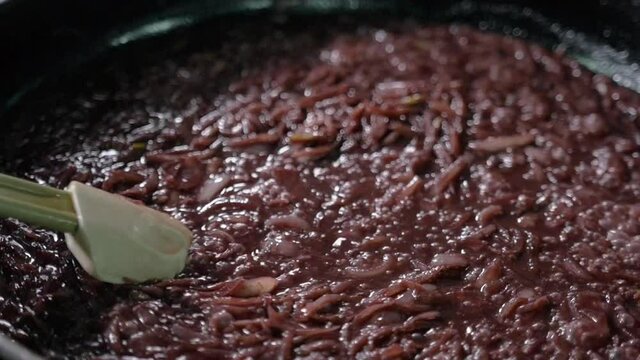 chef at work cooking sause with wine