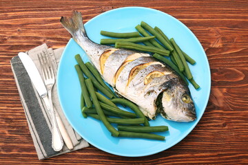 Grilled sea bream fish with green beans