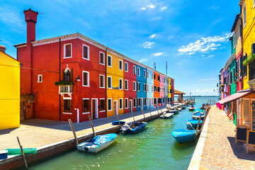 Fototapeta na wymiar Venice landmark, Burano island canal, colorful houses and boats, Italy