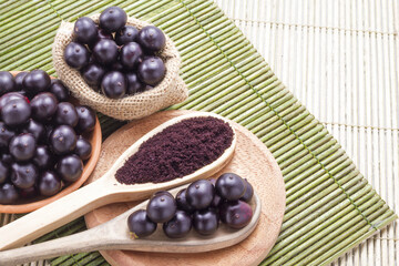 Fruits and acai powder originating from the Amazon  (Euterpe oleracea)
