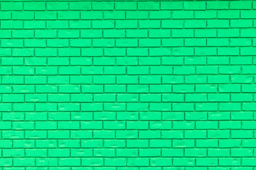 Fototapeta na wymiar Green brick wall for use as a background.