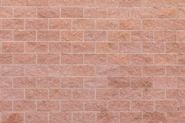 Stone wall with orange stones for a background.