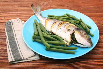 Grilled sea bream fish with green beans