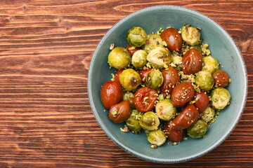 Oven baked brussels sprouts and tomatoes with pistachios