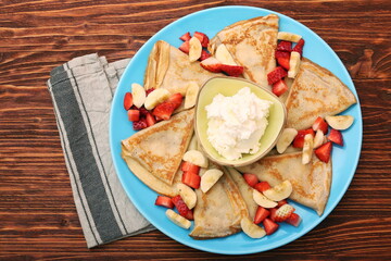 Delicious pancake with sliced of strawberry and banana