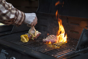 Beef steaks on the grill with flames - 157483427