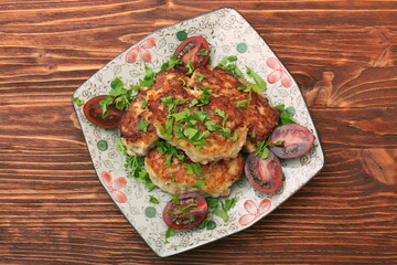 Chicken cutlets on wooden background