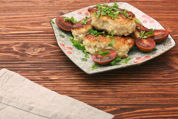 Chicken cutlets on wooden background