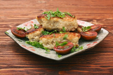Chicken cutlets on wooden background
