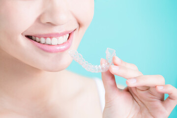 woman take invisible braces