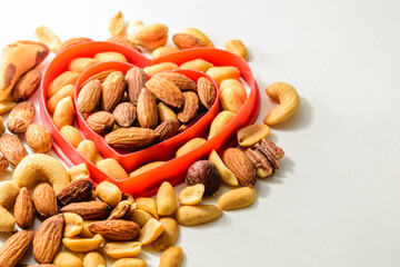 Isolated mixed nuts in a double heart shape