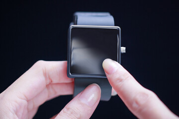 Hand touching smartwatch