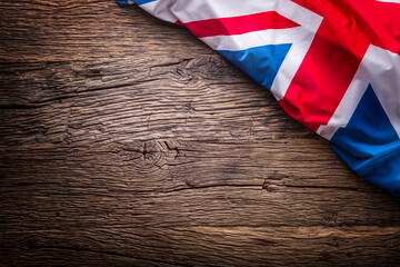 Fototapeta na wymiar Flag of United Kingdom on old wooden background. Union Jack flag on old oak background.