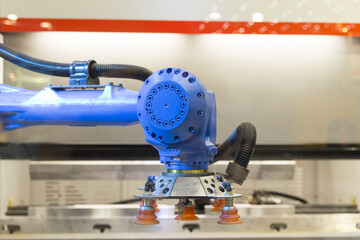 The automatic robot arm  for sheet metal forming factory. Industrial 4.0 concept.Modern technology for manufacturing