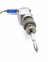 Old electric screwdriver close-up on a white background.