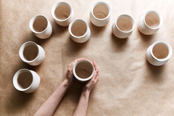 Potter holding a pot