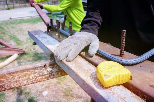 Construction Workers Are Bending Steel