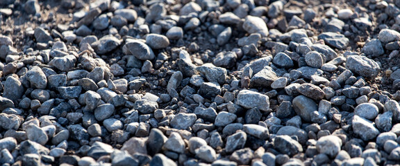 Crushed stone on the road as a background