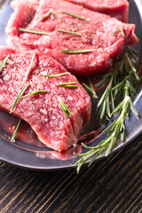 Beef steak with rosemary , salt and pepper.