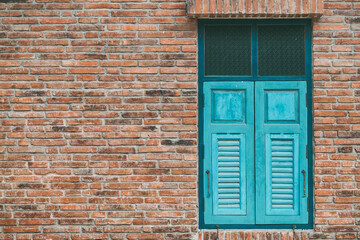 old wood window on brick wall