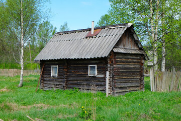 Fototapeta na wymiar old wooden bath house in the Russian village