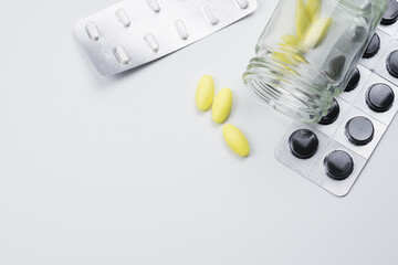 medical drug with white background , yellow and black pill