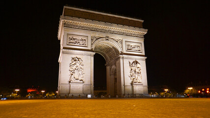 Fototapeta na wymiar Night photo of iconic Arc de Triomphe in Champs Elysees, Paris, France