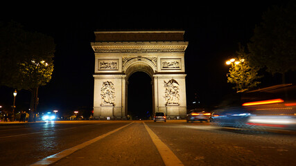 Fototapeta na wymiar Night photo of iconic Arc de Triomphe in Champs Elysees, Paris, France