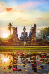 Wat Mahathat Temple at Sukhothai Historical Park, a UNESCO World Heritage Site in Thailand - obrazy, fototapety, plakaty