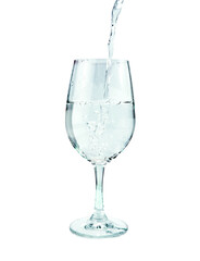 water pouring in a glass on isolated on white background